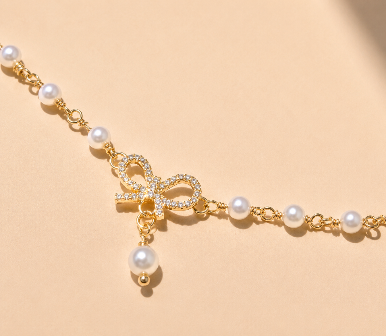 Elegant Pearl Bow Charm Bracelet