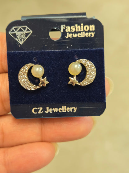 Moon and Star Pearl Studs in Silver Tone