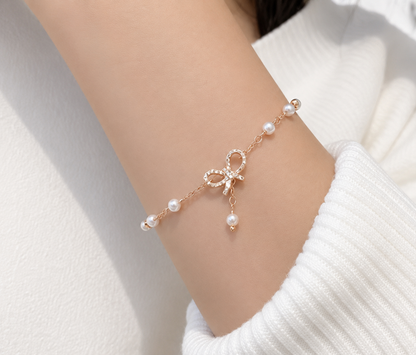 Elegant Pearl Bow Charm Bracelet