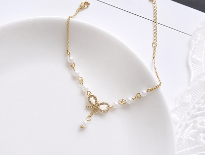 Elegant Pearl Bow Charm Bracelet