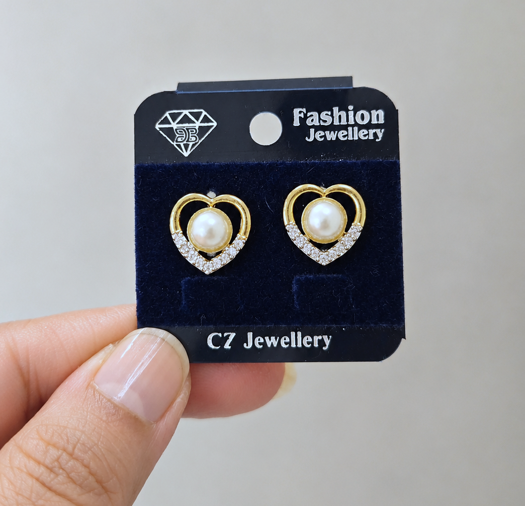 Heart Shaped Pearl Studs in Gold Tone